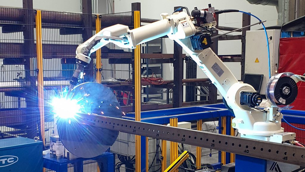 Image showing ES3's new OTC robot welder fabricating a rotating welding table.